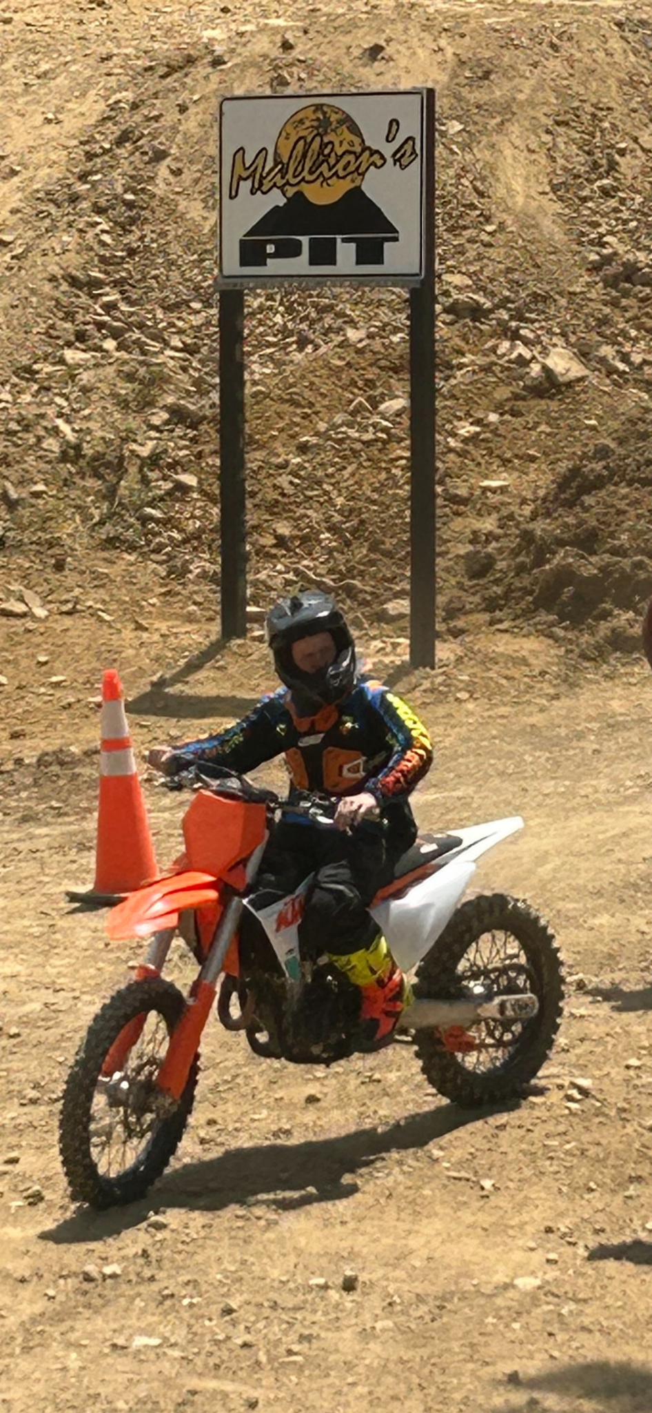 Dirt bike and Million's Pit sign