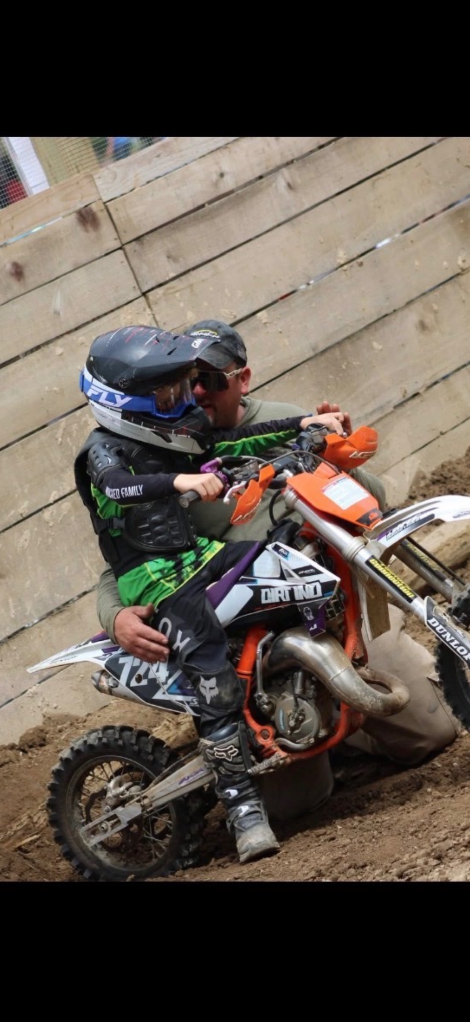 Youth dirt bike rider with an adult after a run at Moonshine Hillclimb